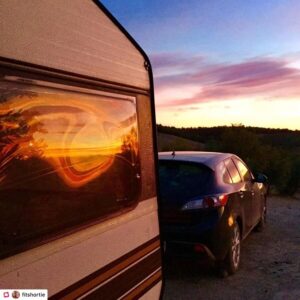 Sun rays reflecting on our caravan window at sunset in Granada Spain